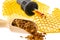 Propolis tincture and a wooden spoon of propolis granules