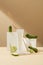 The props are arranged on a minimalist background with fresh cucumbers. Home-made cosmetics concept. The image brings a gentle,