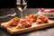 prosciutto bruschetta served with a glass of white wine