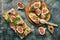 Prosciutto with figs . Fresh figs with ham and cheese on a grilled toast, rustic background. Appetizing snack. Top view,toned