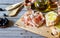 Prosciutto ham and bread on a wooden background. Italian cuisine. Rustic style