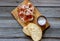 Prosciutto ham and bread on a wooden background. Italian cuisine. Rustic style