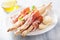 Prosciutto ham and grissini bread sticks. italian antipasto