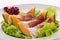 Prosciutto, melon, salad leaf and currants