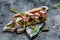prosciutto sandwich, Ciabatta with prosciutto, sun-dried tomatoes, gherkins, parmesan and arugula, banner, menu, recipe
