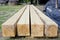 The prospect of four huge pine wooden beams for the roof of a vi