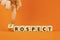 Prospect or retrospect symbol. Concept word Retrospect or Prospect on beautiful wooden cubes. Beautiful orange background.
