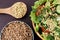 Prospects buckwheat. Fresh vegetable salad. Cooked porridge. Brown background