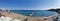 Protaras. Famagusta area. Cyprus. Panorama. Sandy beach of Fig Tree Bay in the morning, a small island in the Mediterranean Sea