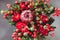 Protea and ranunculuses Bouquet on a blured gray background