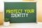 Protect Your Identity in chalk on the school board, Search engine optimization and websites. Desk, swept balls of paper, computer