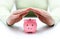 Protect your savings - with hands and piggy bank