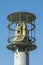 Protected outdoor security camera against a blue sky. opy space. vertical photo