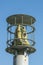 Protected outdoor security camera against a blue sky. opy space. vertical photo