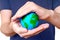 Protecting the Planet: Small Globe in Cupped Hands Shelter