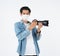 Protection against contagious disease, coronavirus.Asian camera photographer young man wearing hygienic mask prevent infection,