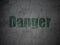 Protection concept: Danger on grunge wall background