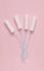 Protection concept for menstruation tampons on a pink background. vertical photo