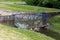 Protection gate in flood water relief canal made to stop garbage from flowing through