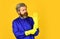 Protection. Man wear rubber gloves. Bearded cleaner in blue uniform yellow background. Spring cleaning. Hipster clean