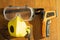 Protective eyewear yellow mask with outlet valve and infrared contactless thermometer on a wooden floor