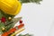 Protective helmet, mason tools and Christmas decorations on white background