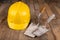 Protective helmet and tools for bricklayer. Work accessories for production workers