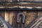 Protective horseshoe nailed on a wooden door.