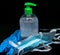 Protective mask , blue latex gloves and transparent  plastic botle with antibacterial sanitizer fluid