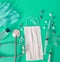 Protective mask, vaccine, COVID 19 diagnosis and prevention medical supplies and tools on green background