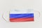 Protective medical mask with the flag of Russia. Symbol of closing state borders and pandemic control