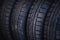 Protector of automobile tires. A number of automobile tires. Close up view on auto mobile new wheel tire s