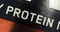 Protein, diagonal close-up inscription on a black background with variable focus