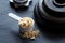 Protein powder and weight plates on slate background