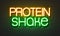 Protein shake neon sign on brick wall background.