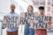 Protest, crowd and poster of peace, racism and justice in city street rally, fight and human rights freedom rally