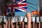 Protest in Fiji - police officers stand against the angry crowd on flag background, revolt fighting concept, military 3D