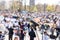 Protest or public demonstration, focus on microphone, blurred crowd of people in the background