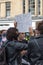 Protester holding Dump Trump sign at a protest demonstration rally