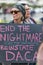Protester holds a sign that reads End the Nightmare for dreamers