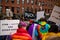 Protester marching for a peace pride rainbow flag at the Boston March for Our Lives political rally