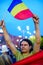 Protester raising flag, Bucharest, Romania