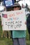 Protester sign Take back America Impeach Trump