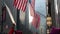 Protester waves sign below row of American Flags at Women`s March