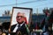 Protesters hold a portrait of Palestinian President Mahmud Abbas during a demonstration against Israel`s West Bank annexation plan