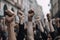 Protesters raising their fist and shouting in a blurry cityscape background. Human movement and protest concept with realistic