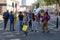 Protesters on Whitehall turning to see smoke being released in Parliament Square, London at an Extinction Rebellion protest march