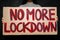 Protestive placard against coronavirus lockdowns against wall