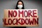 Protestive placard against coronavirus lockdowns against wall
