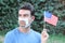 Protestor with broken surgical mask in the USA